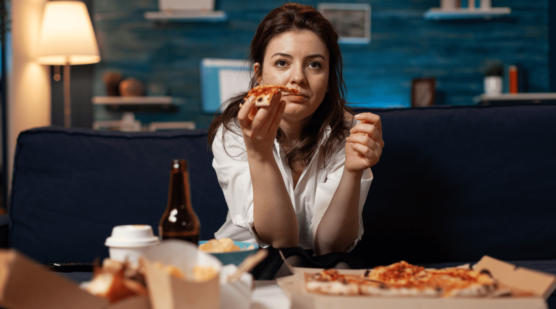 lady eating pizza